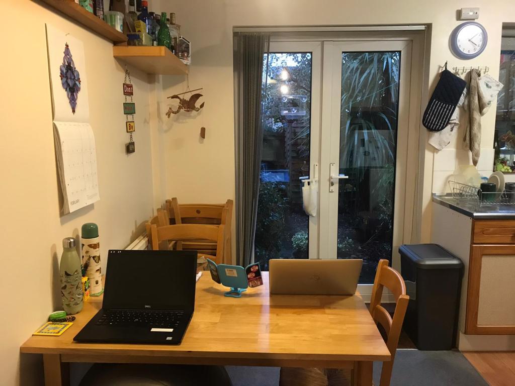 Kitchen table set up as a home office