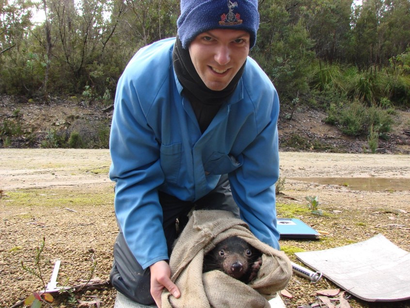 Jack Ashby with a Tasmanian Devil in the field