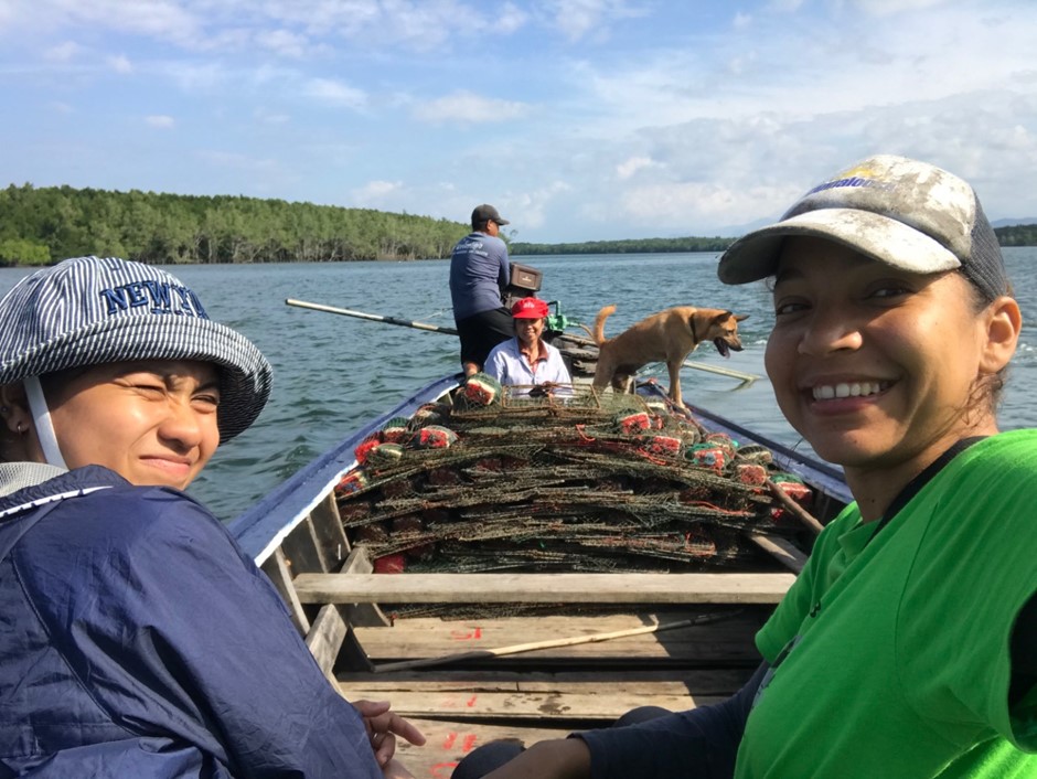 Researchers on a fishing boat in southern Thailand