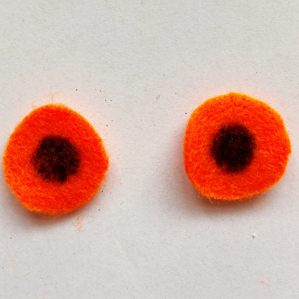 Eyes cut from felt with pupils drawn in felt tip