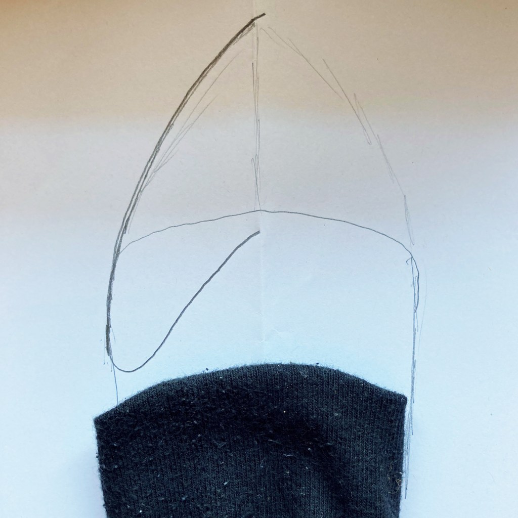 Using the sock to draw the pattern for the beak.