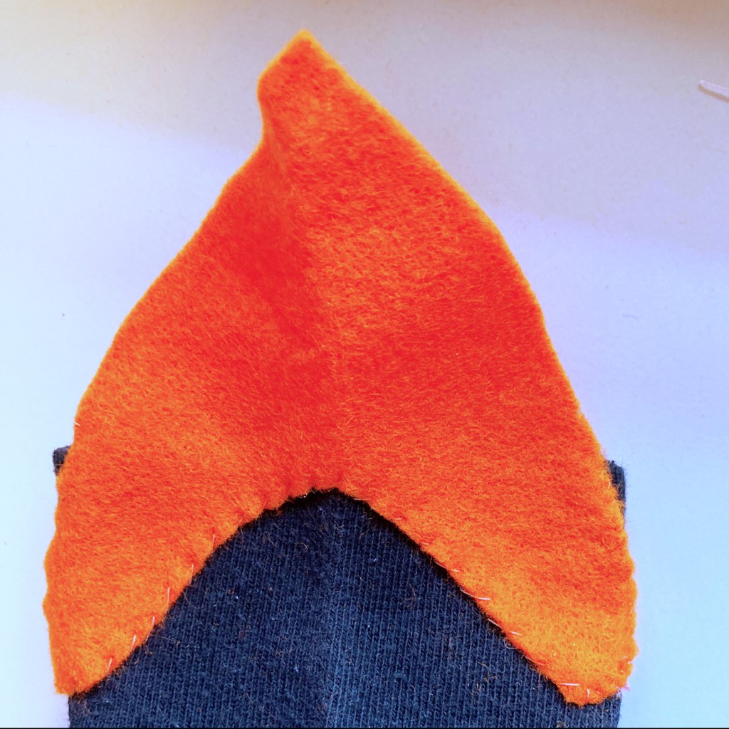 Beak stitched onto the front of the sock