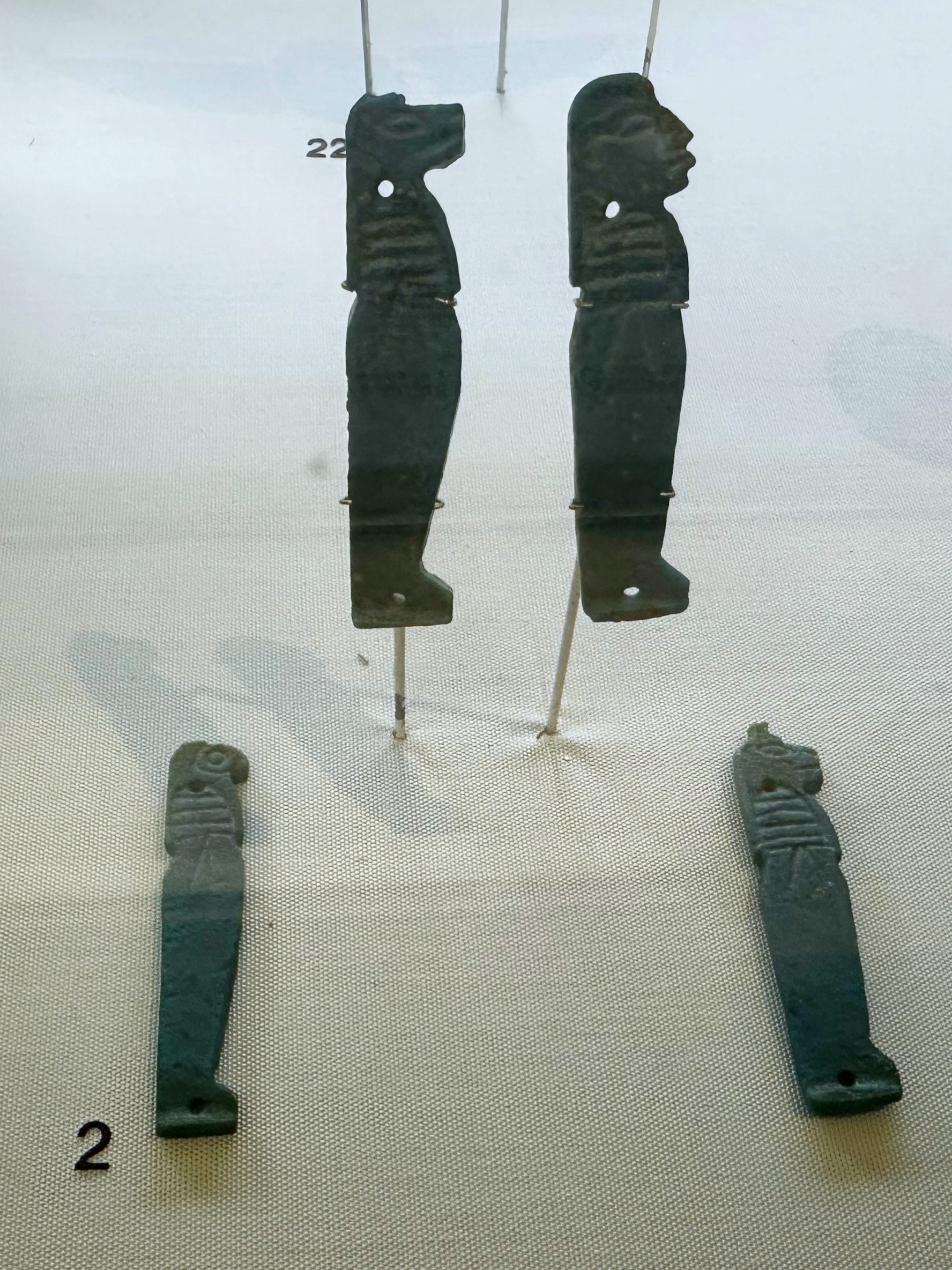 Four Egyptian amulets with the heads of different animals