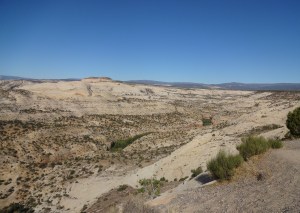 Landscape in Utah, with bare rocks and hills under a blue sky