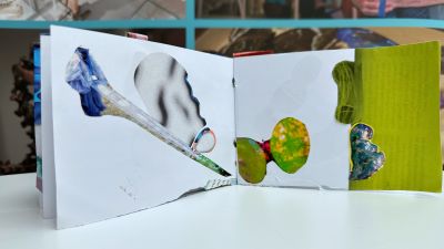 Inside a zine with acollage of abstract images in shades of green