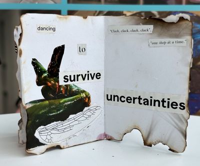 Inside a zine with words dancing to survive uncertainties